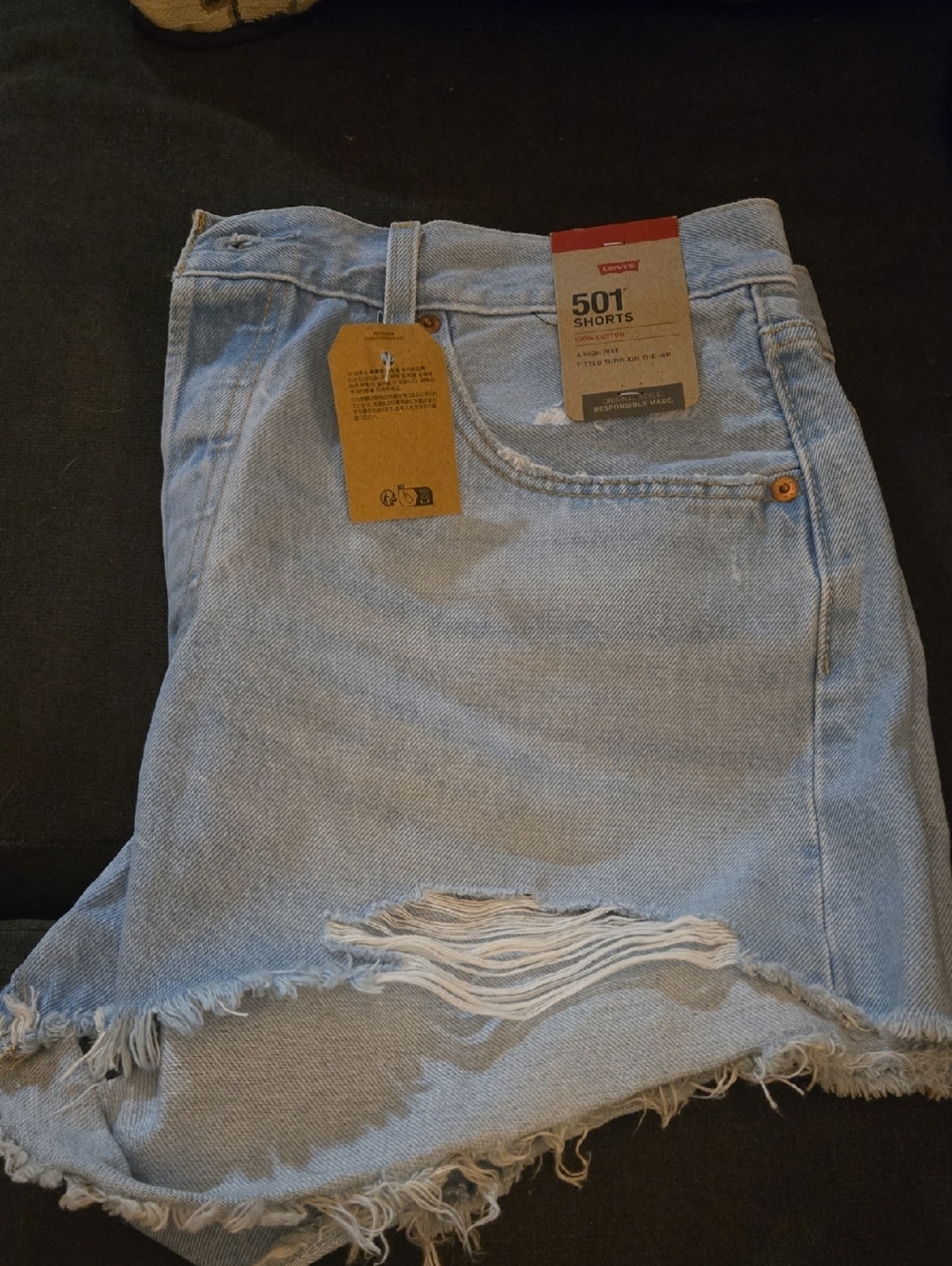 Levi's light blue distressed denim shorts with frayed hem